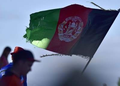 An old Afghanistan flag flies during the Pool A 2015 Cricket World Cup cricket match between New Zealand and Afghanistan at McLean Park in Napier on March 8, 2015.  AFP PHOTO / MARTY MELVILLE        (Photo credit should read Marty Melville/AFP/Getty Images)