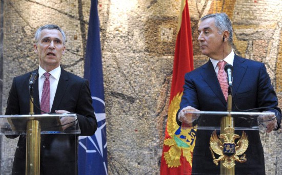 NATO general secretary Jans Soltenber (L) talks during a joint press conference with Montenegrin Prime Minister Milo Djukanovic (R) during their meeting in Podgorica on June 11, 2015. (Photo by Savo Prelevic/AFP/Getty Images)